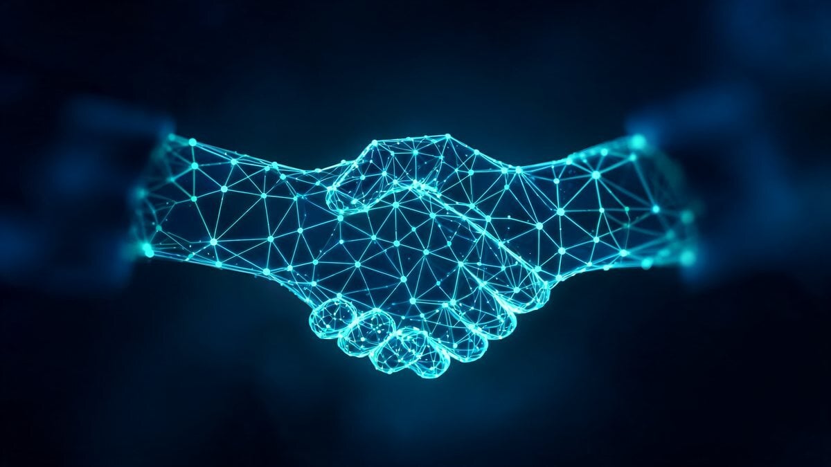 Two glowing wireframe hands clasped in a handshake on a dark blue background