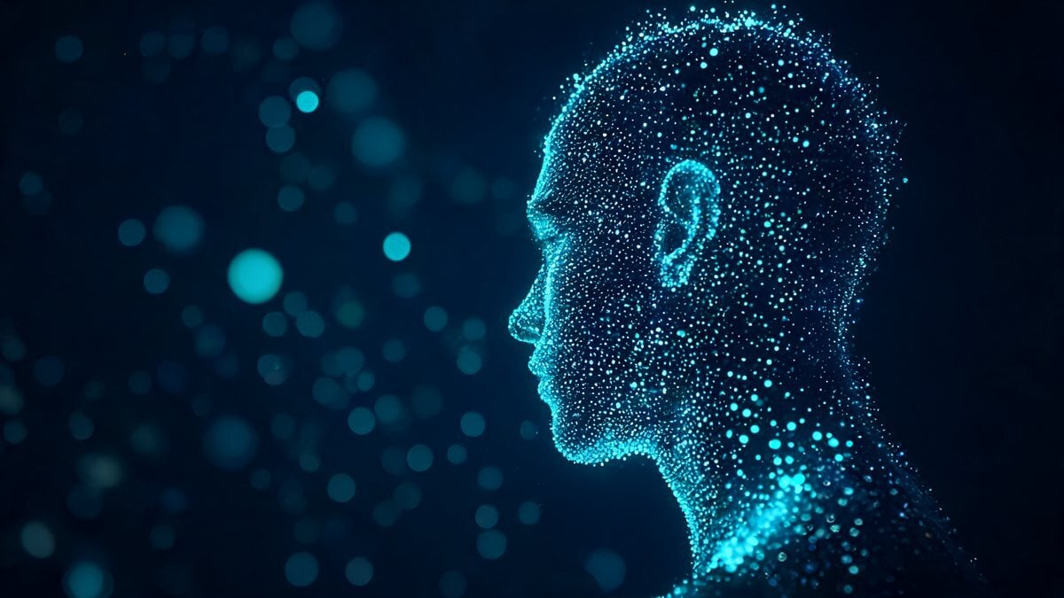 A head in profile made of glowing cyan particles on a dark background