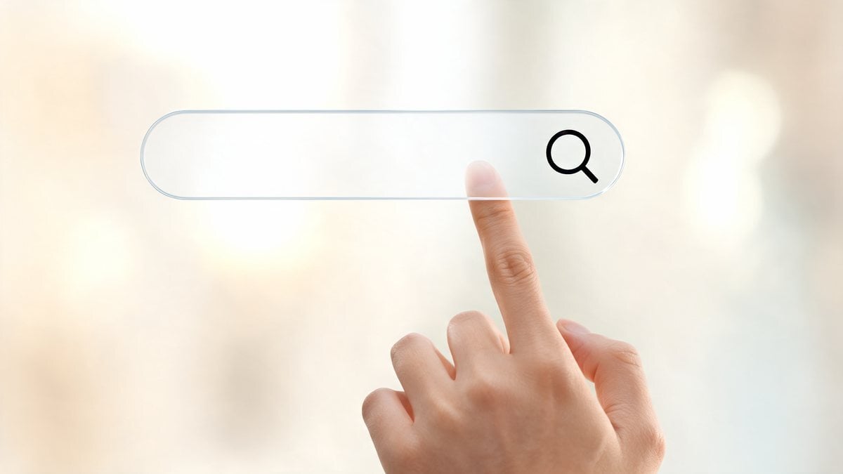 A pointing hand beside a floating translucent search bar